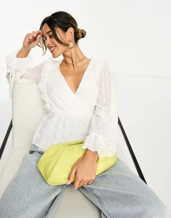 long sleeve textured top with wrap & ruffle cuff in ivory