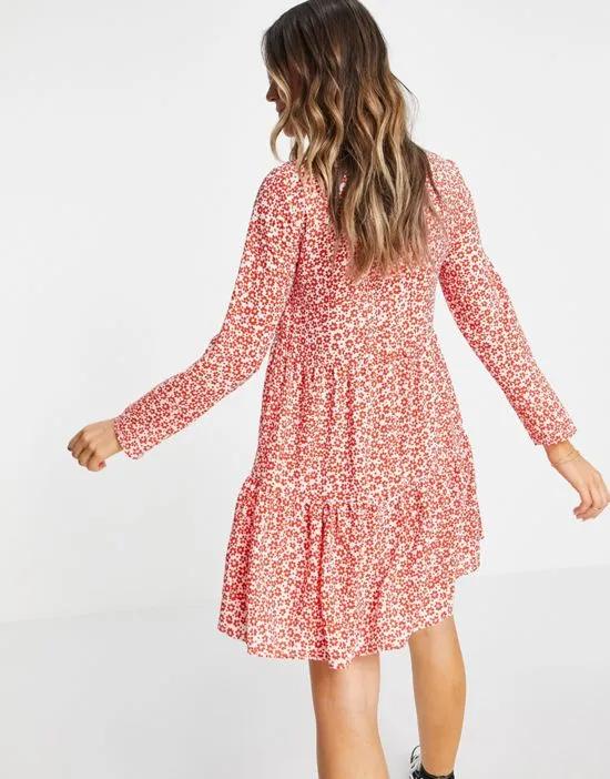 long sleeve tiered smock mini dress in red and white floral print