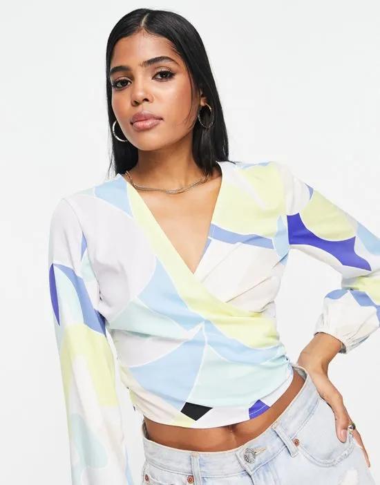 long sleeve wrap blouse in retro abstract print