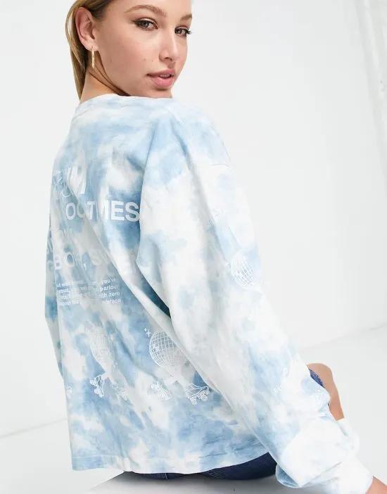 long sleeved top with 'no regrets' logo in blue tie dye