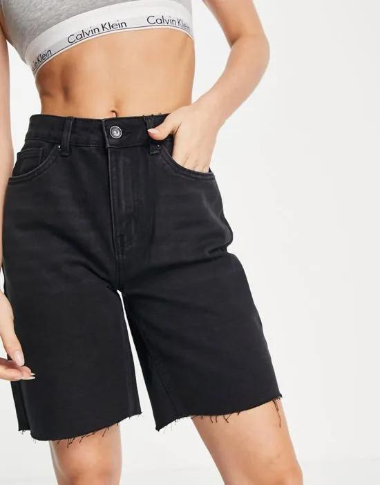 longline denim shorts with raw hem in black
