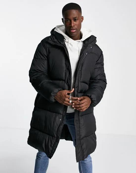 longline puffer jacket with hood in black