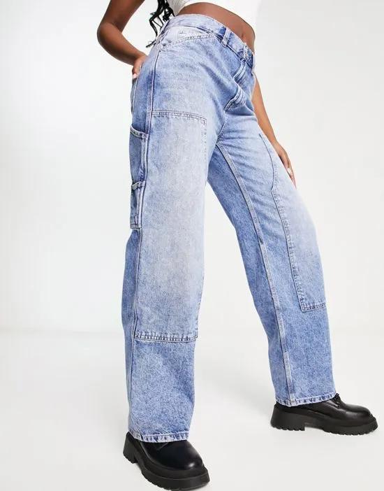 low rise baggy boyfriend jeans with knee patches in mid blue