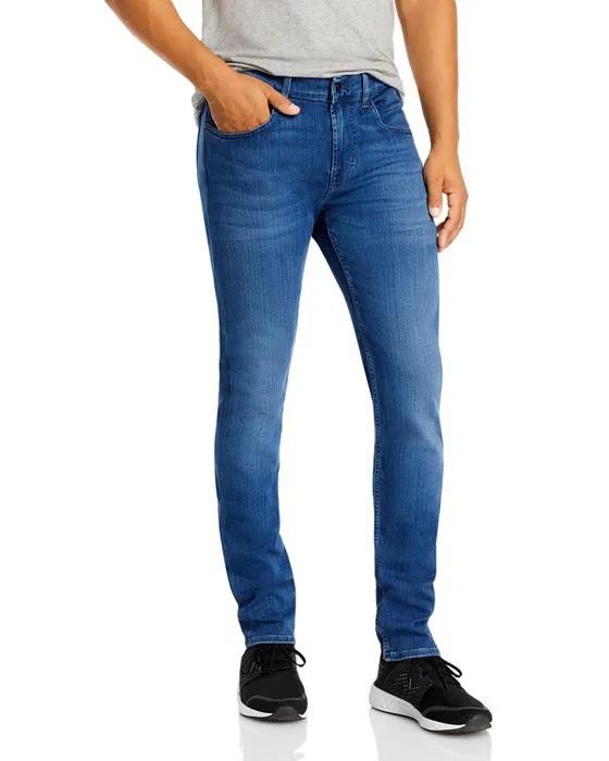 Luxe Performance Plus Slimmy Tapered Slim Fit Jeans in Mid Blue
