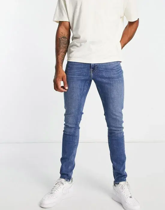 Malone skinny fit jeans in mid worn wash