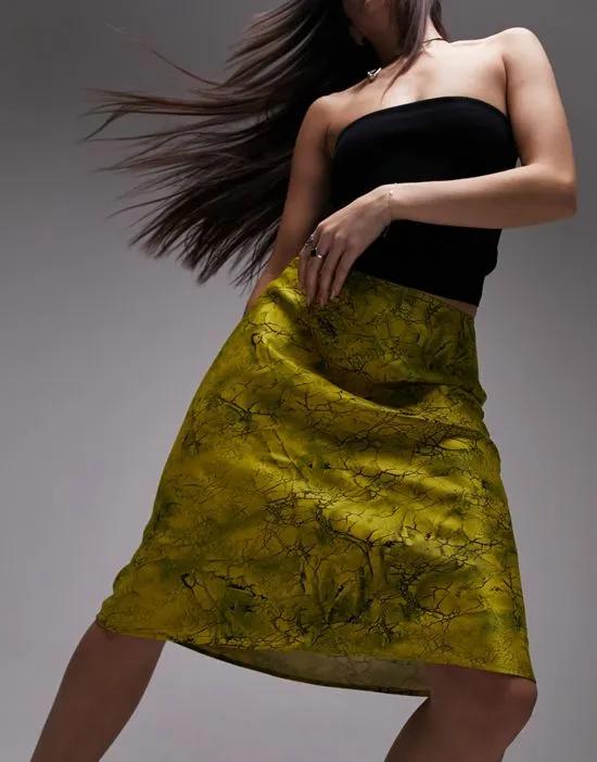 marble crack print 90s length bias skirt in chartreuse