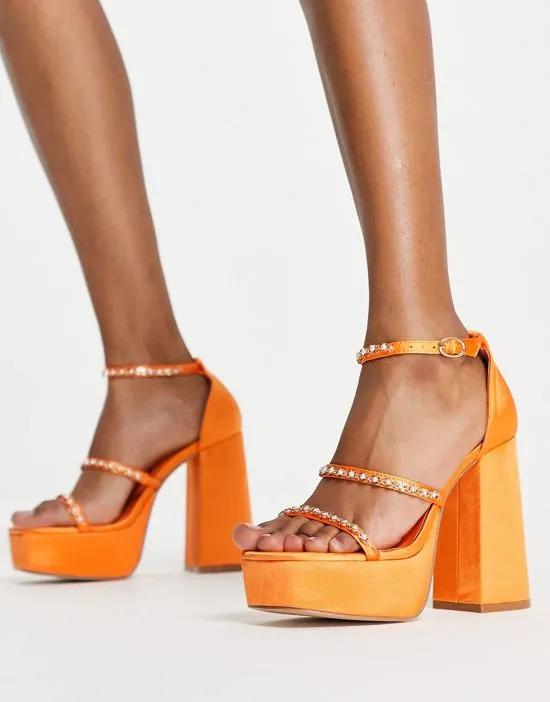 mega platform embellished heeled sandals in orange satin
