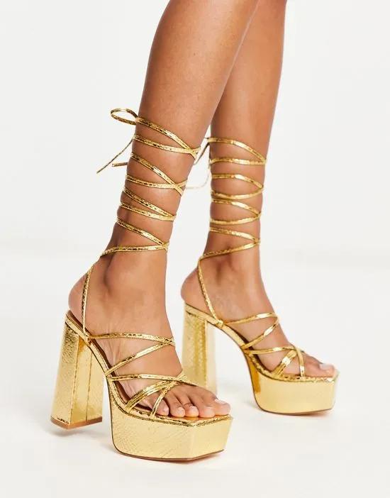 mega platform strappy sandals in gold metallic