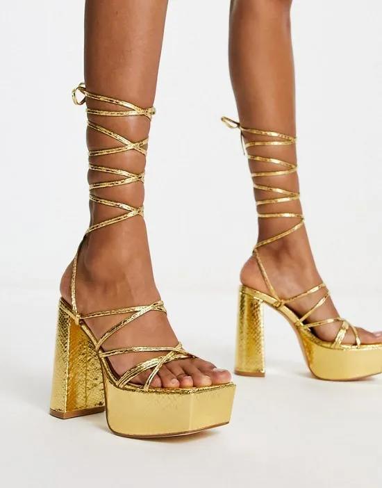 mega platform strappy sandals in gold metallic
