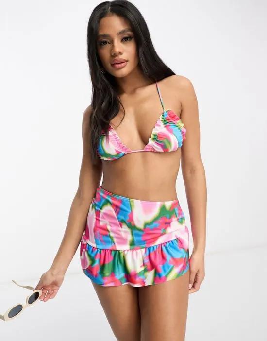 micro swim skirt with frill hem in pink abstract smudge print