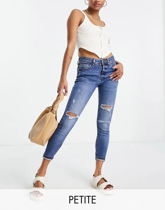 mid rise skinny jeans with rips in dark blue