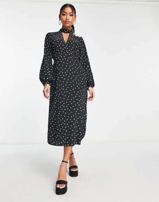 midi dress in black polka dot with heart button detail