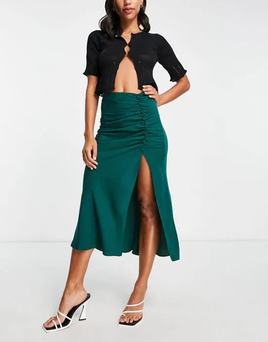 midi skirt with ruched side and button detail in dark green