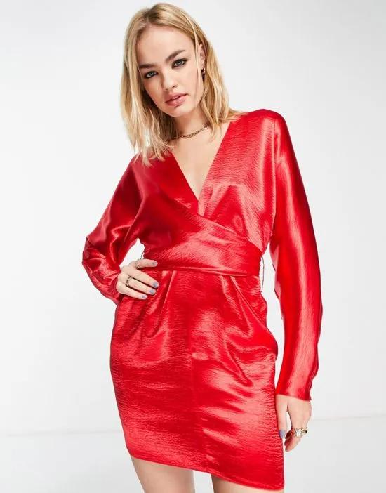 mini dress with batwing sleeve and wrap waist in red satin
