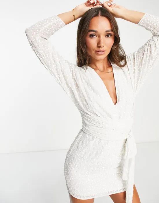 mini dress with batwing sleeve and wrap waist in white scatter sequin