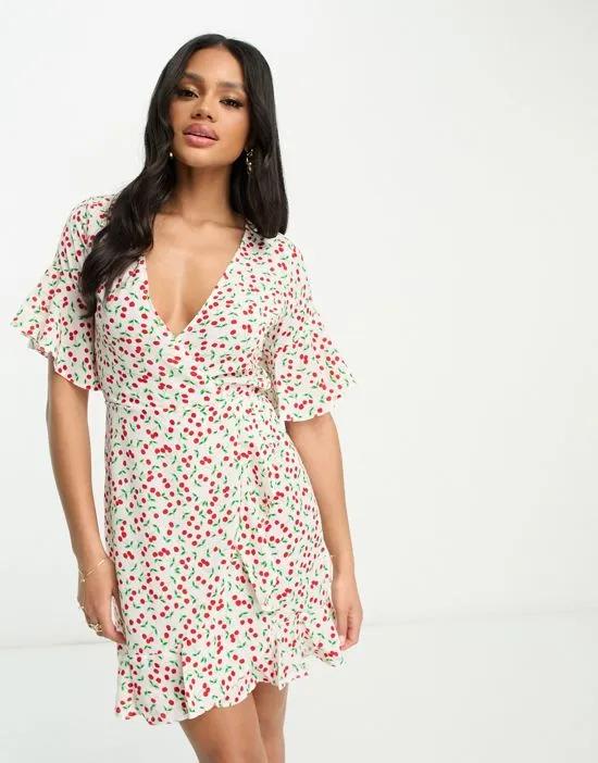 mini wrap dress in cream and red cherry print