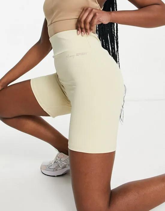 Missy Empire sport ruched booty gym shorts in cream