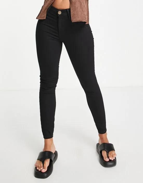 Molly mid rise reform skinny jeans in black