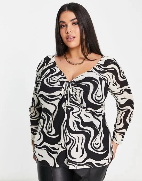 mono swirl mesh cut out long sleeve top in black and white