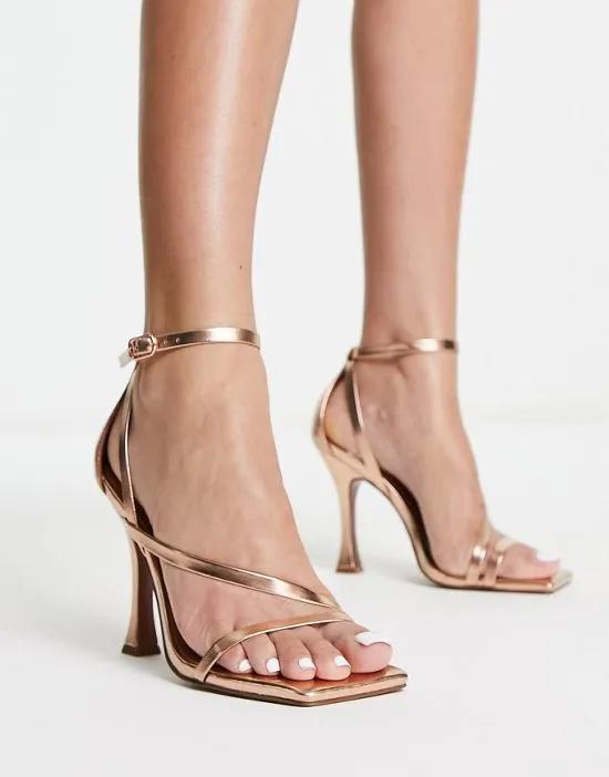 Nelly asymmetric high heeled sandals In rose gold