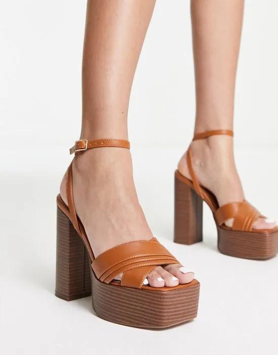 Nocturnal platform high heeled sandals in tan
