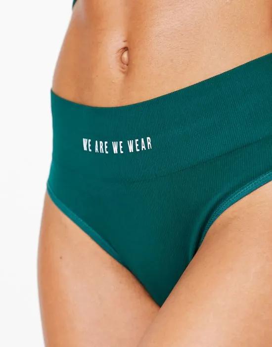 nylon blend seamless high waist thong with logo detail in green - MGREEN