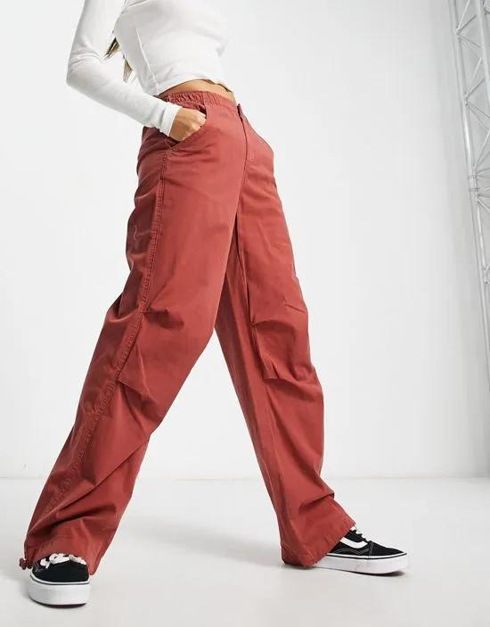 nylon cargo parachute pants in burnt orange