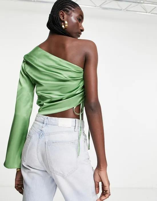 one shoulder long sleeve top with ruched side in green satin