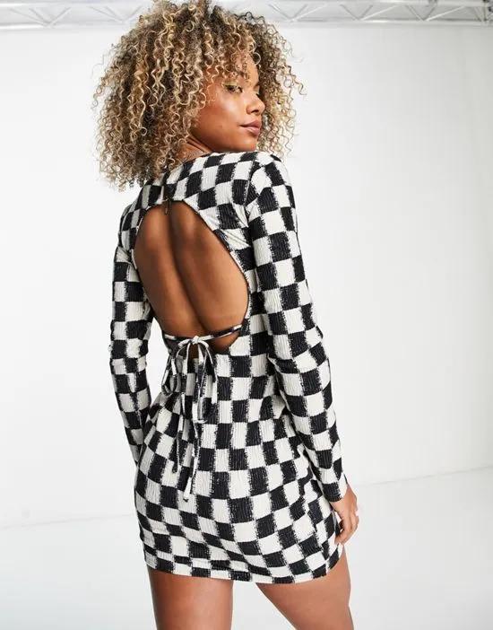 open back body-conscious mini dress in checkboard velvet plisse
