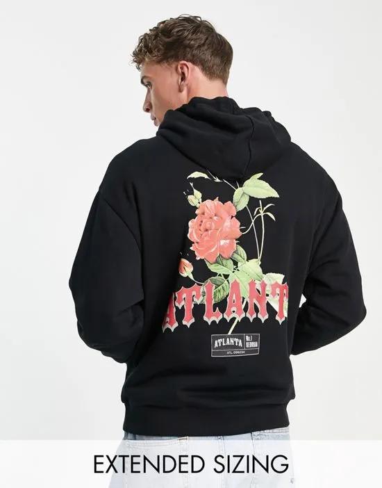 oversized hoodie in black with rose back print and gothic text