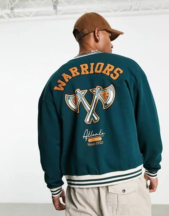 oversized jersey track jacket in teal green with collegiate badging and boucle