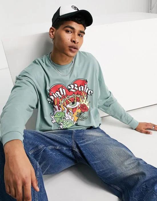 oversized long sleeve t-shirt in light green with cartoon front print