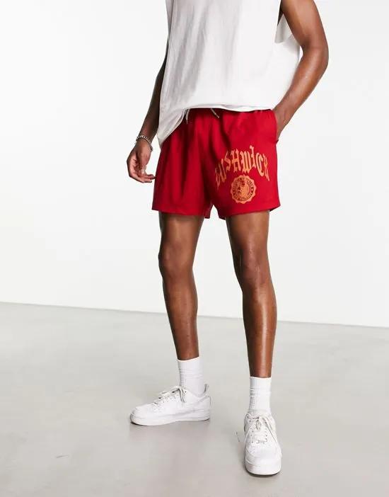 oversized mesh shorts in red with collegiate print