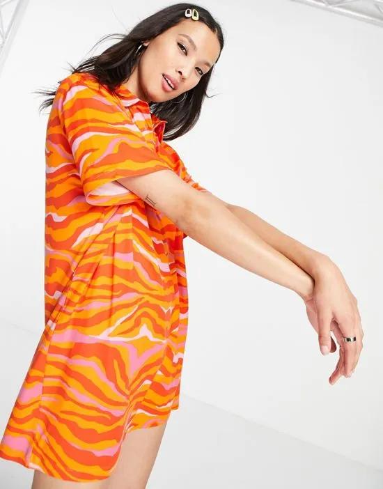oversized polo dress in orange swirl print