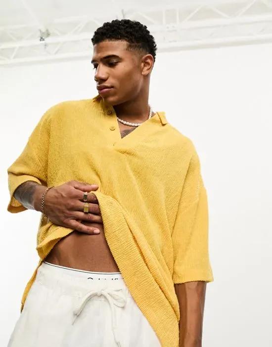 oversized polo shirt in mustard texture with deep v revere collar
