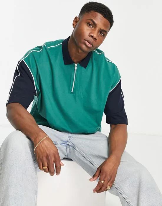 oversized polo T-shirt in green with contrast sleeves & zip neck