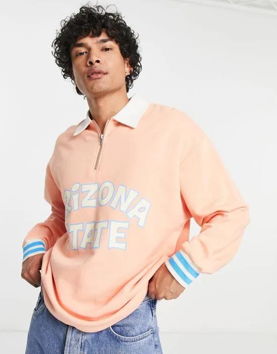 oversized rugby sweatshirt in peach with city print