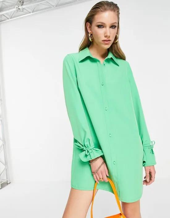oversized shirt dress with tie cuffs in bold green