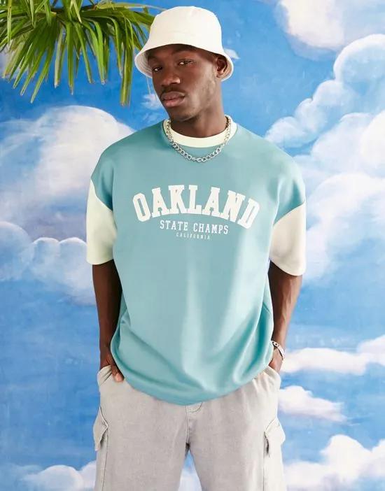 oversized t-shirt in green color block with Oakland city print in scuba