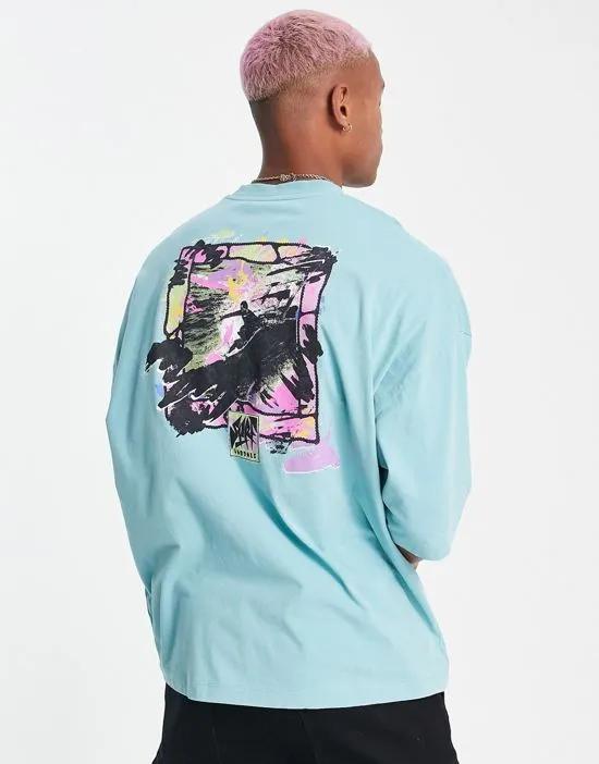 oversized T-shirt in washed blue with retro surf back print