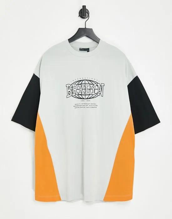 oversized t-shirt in white, orange and black color block with Brooklyn city print