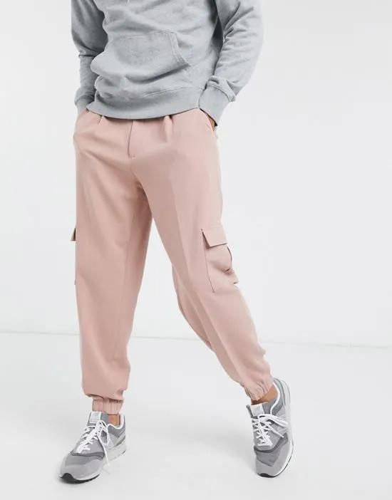 oversized tapered smart sweatpants in pink with cargo pocket