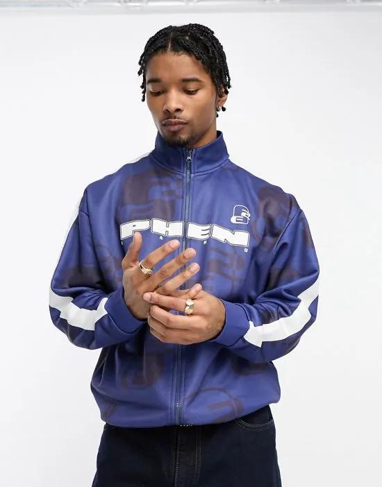 oversized track jacket in navy all over print with taping and high build print