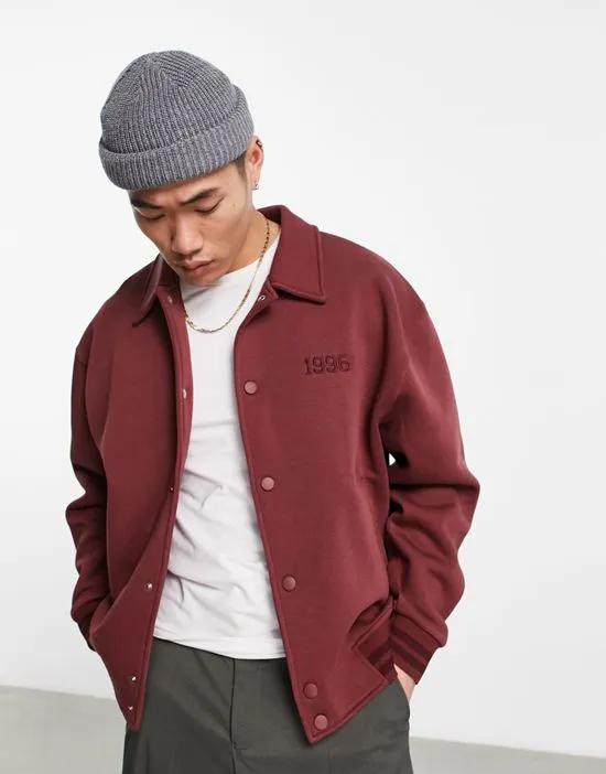 oversized varsity jersey jacket in maroon with back boucle embroidery