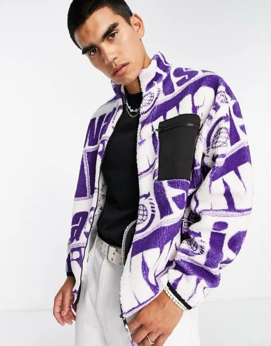 oversized zip up jacket in purple borg with all over text print
