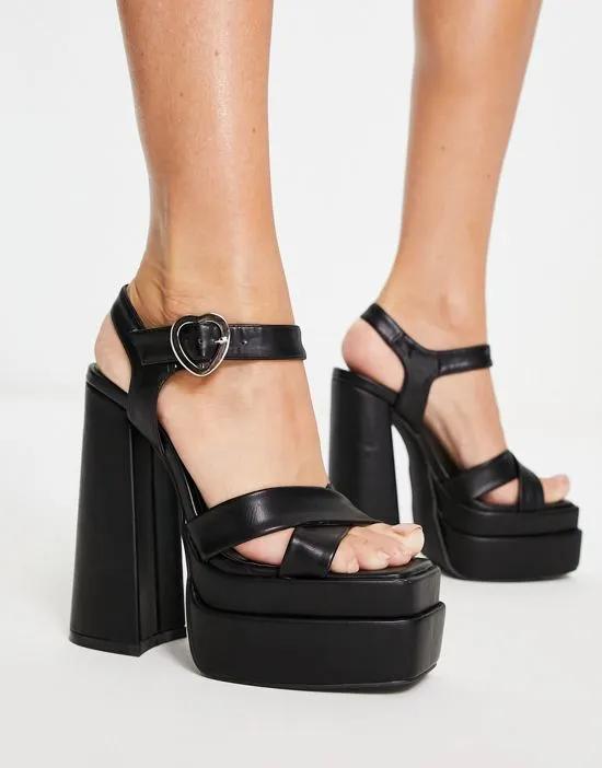platform heel sandals with heart shaped buckle in black