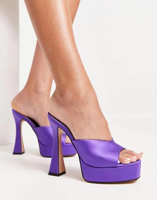 platform heeled mules in bright purple