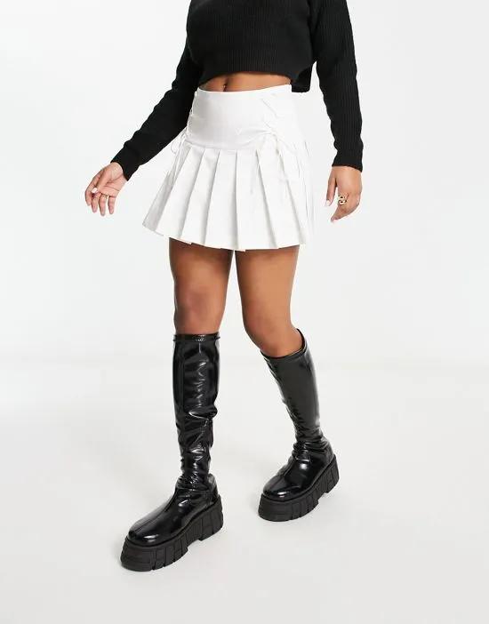 pleated kilt mini skirt with lace-up detail in ivory