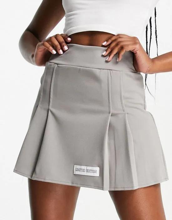 pleated mini skirt in sage
