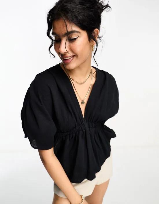 plunge front crinkle top with tie side in black